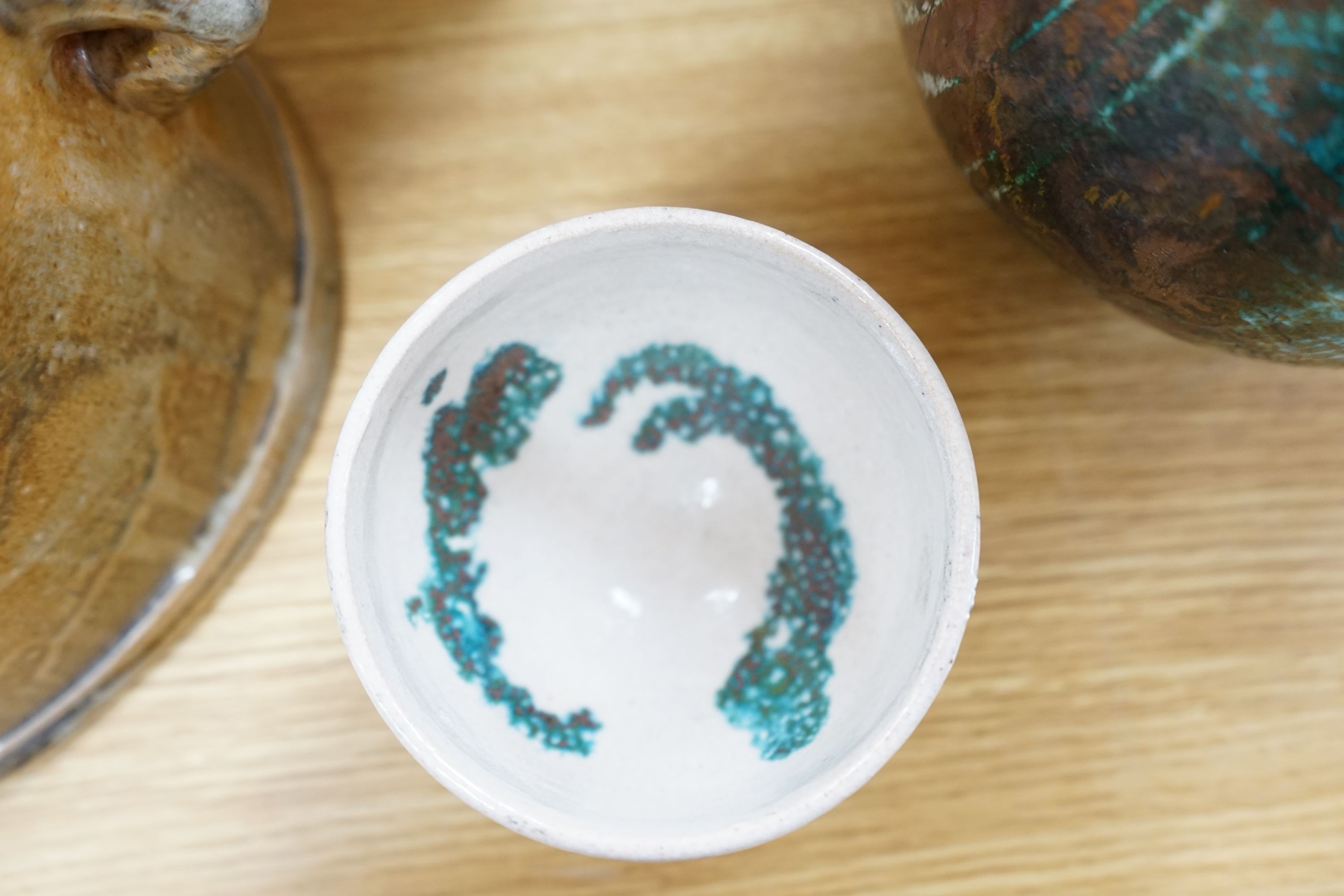 Studio pottery- an Allison Weightman raku fired large albastron form vase, ovoid vase and cup and a Petra Reynolds oval stoneware pot (4) Tallest 44cm